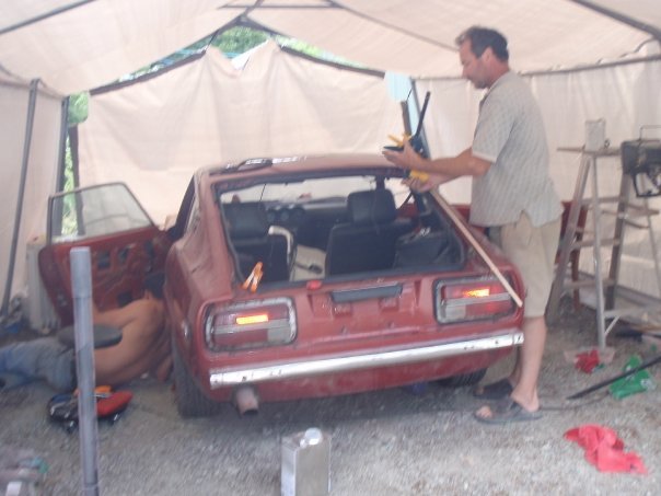 tom and tommy working in shed.jpg